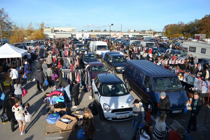 Aerial view of a busy car boot sale happening